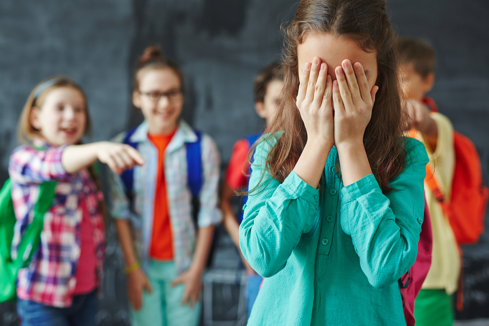 Child being discovered a wetting accident at school