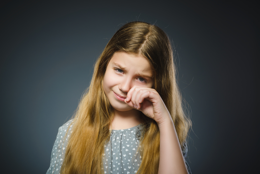 Girl crying because bedwetting issue